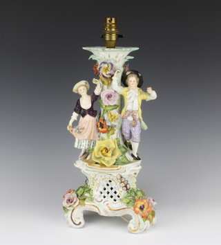 A Dresden porcelain table lamp with floral encrusted decoration supported by gallant and belle 37cm h x 14cm diam. 
