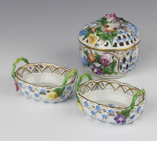 A pair of late Dresden oval pierced porcelain baskets with floral decoration 3cm x 6cm x 5cm and a ditto pierced porcelain jar and cover 6cm x 6cm 