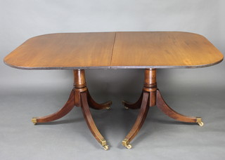 A Georgian style bleached mahogany D end extending dining table with 2 extra leaves, raised on a turned column and tripod base with brass caps and casters 73cm h x 159cm w x 110cm l  x 257cm l when extended 