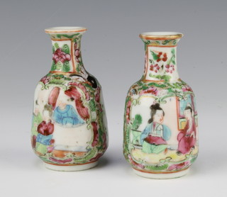 A pair of famille rose tapered baluster vases decorated with panels of figures and insects 8cm 