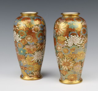 A pair of early 20th Century Satsuma oviform vases decorated with a field of flowers, signature to base 18.5cm 