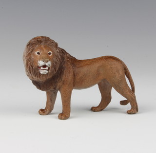 A cold painted bronze figure of a standing lion, the base with urn mark and letter B to the centre 6cm x 8cm 