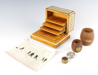 A moorish style inlaid musical cigarette box 9cm x 17cm x 13cm, a black and white photograph of Shackleton's 1922 Expedition "Football while Endurance is ice bound" 16cm x 21cm, 2 teak spill holders formed from teak of HMS Ganges and HMS Iron Duke, a cylindrical jar and cover decorated a George V coin and a circular white metal jar and cover 