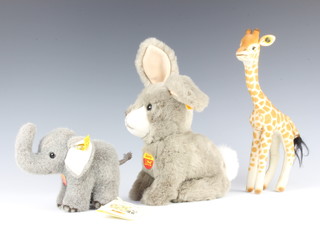 A Steiff figure of a giraffe 25cm, ditto rabbit 23cm and a ditto walking elephant 10cm  