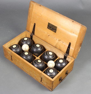 Bussey's, a set of 8 bowling woods and 2 jacks contained in a pine carrying case 