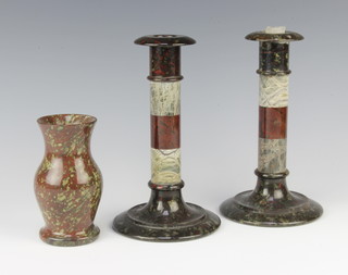 A pair of 1930's Cornish serpentine candlesticks 22cm x 11cm, a ditto waisted vase 12cm x 5cm 