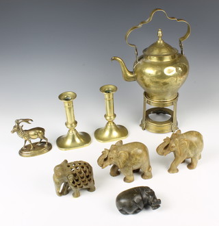 A pair of 18th Century brass candlesticks on shaped bases 16cm, an Eastern brass tea kettle and stand (some dents burner missing), a brass figure of a walking stag on an oval vase 11cm (antlers bent), an Indian carved and pierced figure of an elephant 6cm x 9cm, pair of carved hardstone figures of elephants 9cm and a carved hippopotamus 