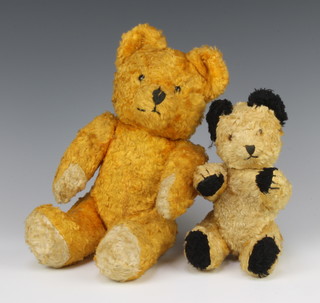 A Sooty style teddy bear 21cm and a yellow teddy bear with articulated limbs 32cm 