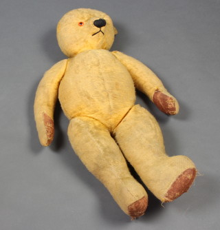 A yellow teddy bear with articulated limbs 71cm 