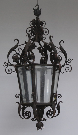 A Venetian style hexagonal wrought iron and bevelled glass hanging hall lantern 96cm x 32cm 
