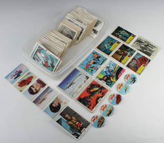 Various black and white Thunderbird trade cards and tea cards together with Moonshot, a set of 55 ABC Land of Giants cards and 5 Captain Scarlet badges