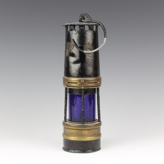A miners safety lamp with blue glass panel to the centre (some dents and has been hammerwrited) 