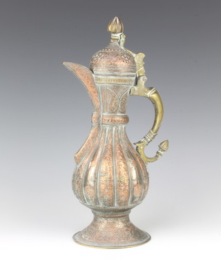 A 19th Century Persian engraved and waisted copper and brass jug 30cm 