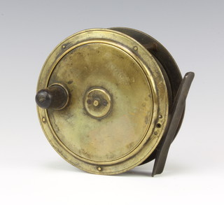 A Victorian brass 4" salmon fishing reel with turned wooden handle 