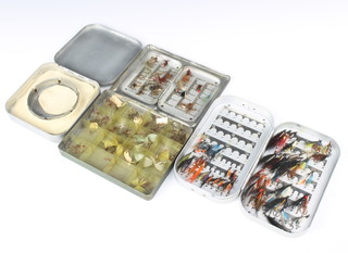 A Wheatley metal fishing fly box, an Okuma fly box, a Hardly fly box and 1 other fly box  