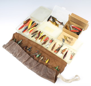A large collection of vintage fishing lures including Hardy Abu, Bruce and Walker etc, contained in a leather roll, 4 plastic lure boxes 