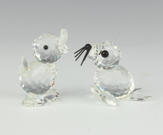 A Swarovski figure of a standing duckling (beak chipped) 4.5cm and one other of a seal 4cm, boxed 