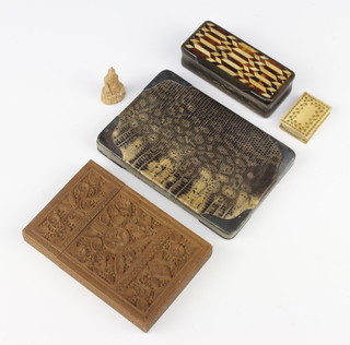 A 19th Century horn snuff box with hinged lid 3cm x 9cm x 4cm, a rectangular ivory pin cushion 1cm x 4cm x 3cm, a carved wooden figure of a deity, a silver mounted and snake skin purse, a Burmese carved hardwood card case  