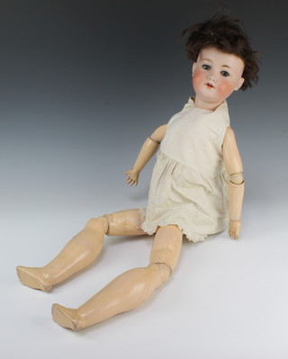 Armand Marseille, a 19th Century German porcelain headed doll with sleep eyes and open mouth with 2 teeth, head incised Armand Marseille Germany 390 A9M with articulated body 