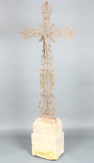 A 19th Century French cast iron crucifix raised on a carved stone base 189cm h x 74cm w 