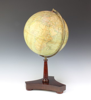 A Phillips 12" library terrestrial globe raised on a mahogany column and triform base 
