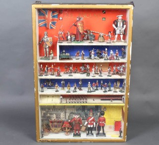A diorama depicting English military life from 1027 to 1953 contained in a gilt hanging display cabinet 24cm x 60cm x 10cm  