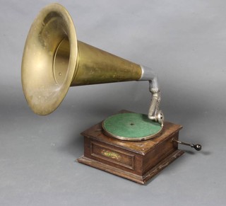 The Winner Horn, a gramophone contained in a mahogany case with brass and polished aluminium horn and having a Decca sound box 