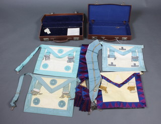 Two Masonic cases containing Past Masters apron, collar jewel and collar, 2 Master Masons aprons and a Royal Arch companions apron and sash 