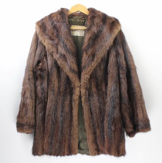 A lady's brown fur coat and a lady's brown full length "beaver lamb"  coat 