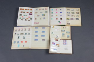 Three stock books of Elizabeth II mint GB stamps, 1 other stock book of GB and world stamps 