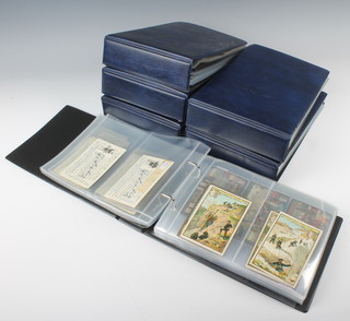 Six blue ring bound albums of Continental trade cards 
