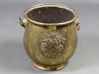 A circular Dutch twin handled coal bin with armorial decoration and lion mask handles 34cm x 34cm 