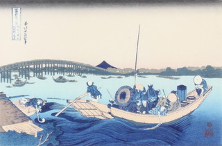 A Japanese coloured woodblock print , figures in a boat by a bridge 15cm x 28cm 
