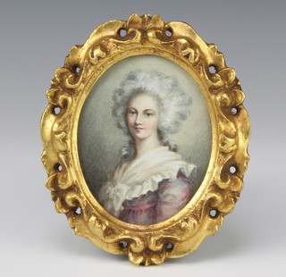 An oval portrait miniature on paper, study of an 18th Century lady contained in a gilt carved wood frame 10cm x 8cm 