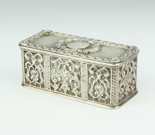 A George IV rectangular silver table top snuff box, the cast decoration with formal scrolls and flowers, having an engraved monogram, London 1823, maker Robert Garrard II, 9.5cm x 4cm x 4cm, 242 grams
