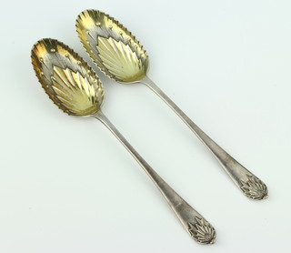 A pair of Victorian cast silver serving spoons with leaf decoration Birmingham 1894, 137 grams