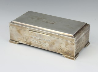 A Sterling silver engine turned rectangular cigarette box on bracket feet 18cm x 9cm x 6cm 