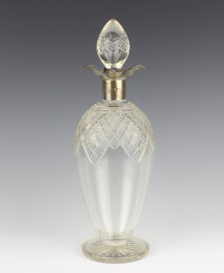 A cut glass and silver mounted spirit decanter Birmingham 1927, maker William Hutton and Sons Ltd 31dm 