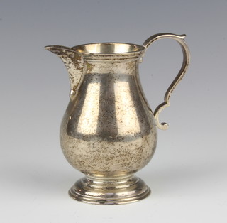 A Queen Anne style silver baluster cream jug with S scroll handle 9cm London 1961, maker Nayler Brothers, 135 grams