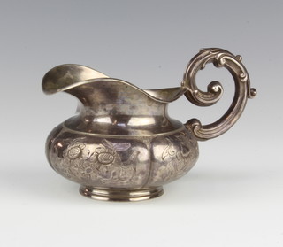 A Continental silver baluster cream jug with fancy handle 96 grams