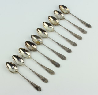 Ten Edwardian silver teaspoons with chased decoration 168 grams