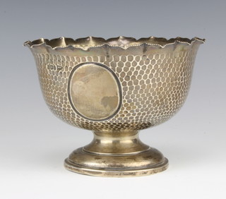 A silver hammer pattern pedestal bowl with vacant cartouche Sheffield 1908 15cm 216 grams, maker Walker and Hall 