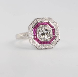 An 18ct white gold diamond and ruby Art Deco style octagonal ring, the centre stone approx. 0.65ct size M 1/2
