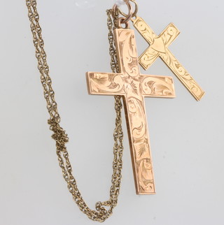 Two 9ct yellow gold cross pendants on a ditto chain, 5 grams