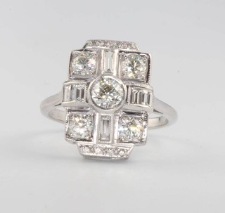 An 18ct white gold Art Deco style brilliant and baguette cut diamond ring, size P 