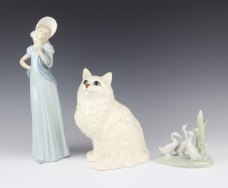 A Nao figure of a bonnetted lady 30cm, Nao figure group of geese 12cm and a Beswick figure of a seated white cat 21cm (chip to ear) 