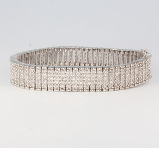 A 9ct white gold wide diamond set bracelet, approx 5.5ct, containing 325 diamonds, 39.2 grams, 190mm long x 12mm wide 