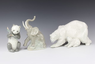 A Nao figure of a polar bear and cub, ditto panda 15cm and one other of an elephant 21cm 