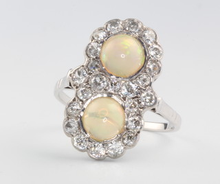 An 18ct white gold opal and diamond double cluster ring size Q 1/2