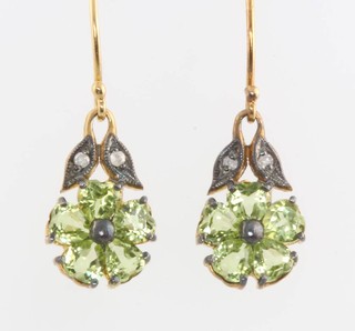 A pair of Edwardian style silver gilt peridot and diamond earrings 